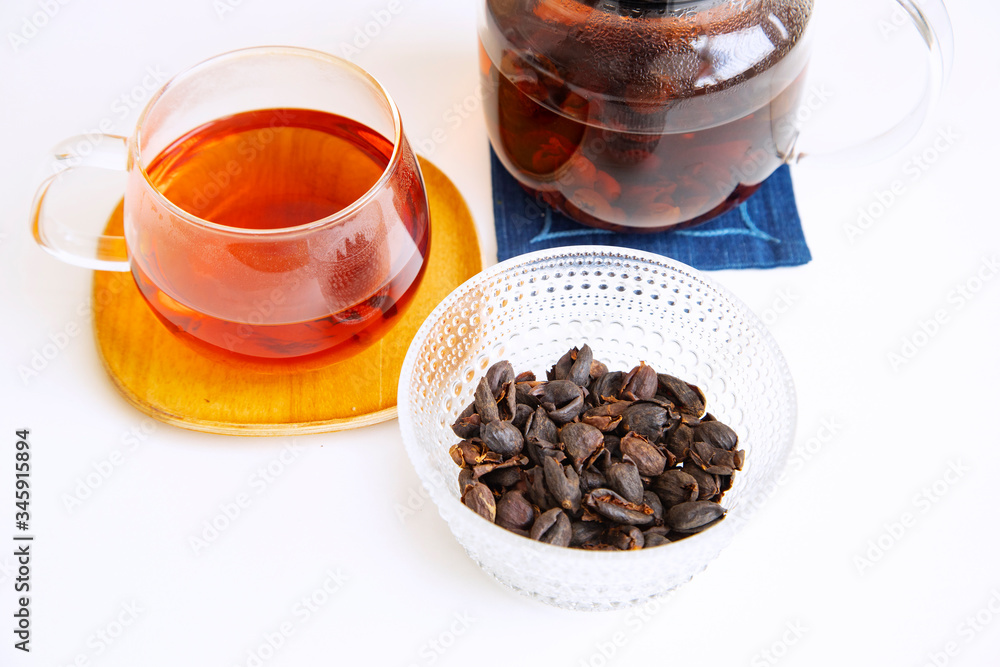 Coffee cherry tea on the white background Coffee cherry tea on the white background