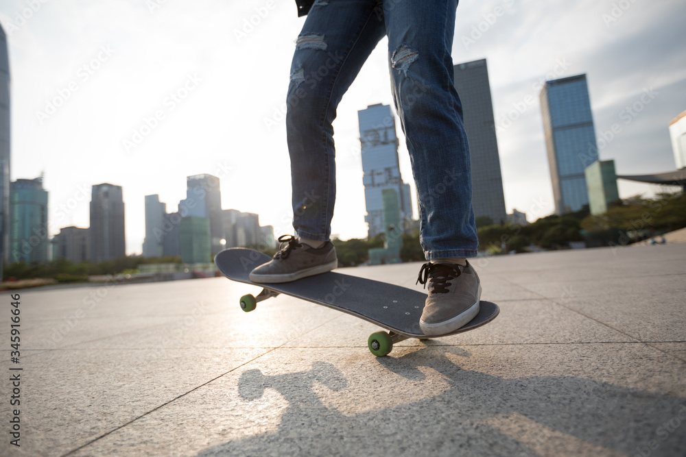 Skateboarder skateboarding at sunset city Skateboarder skateboarding at sunset city