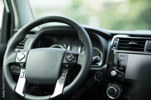 Black steering wheel in luxury car © lzf