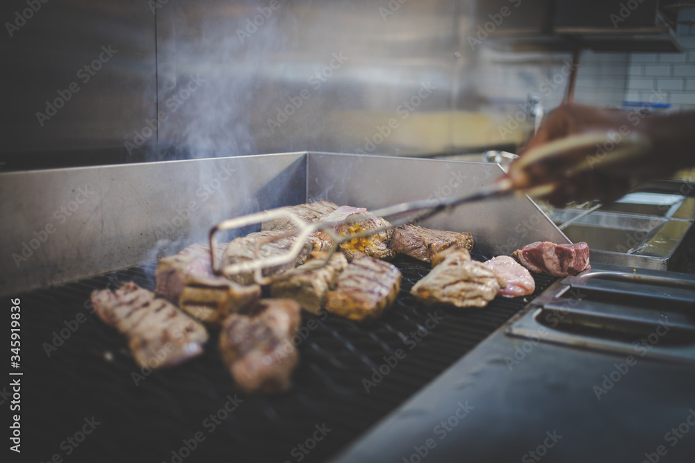 Close up images of steak being grilled to perfection in a gourmet restaurant
