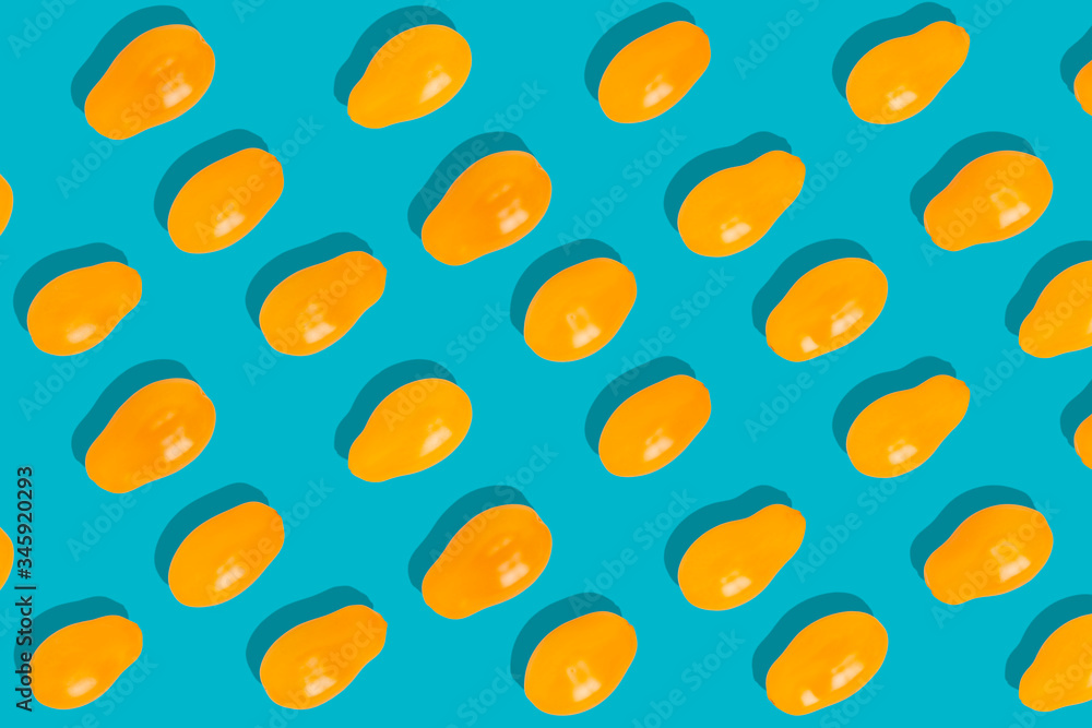 Colorful pattern of yellow tomatoes on a green background. Colorful pattern of yellow tomatoes on a green background.
