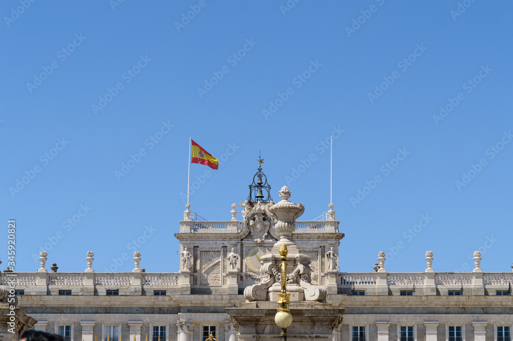 High Facade Of The Royal Palace Of Madrid Waving The Spanish Flag In The Wind. June 15, 2019. Madrid. Spain. Travel Tourism Holidays