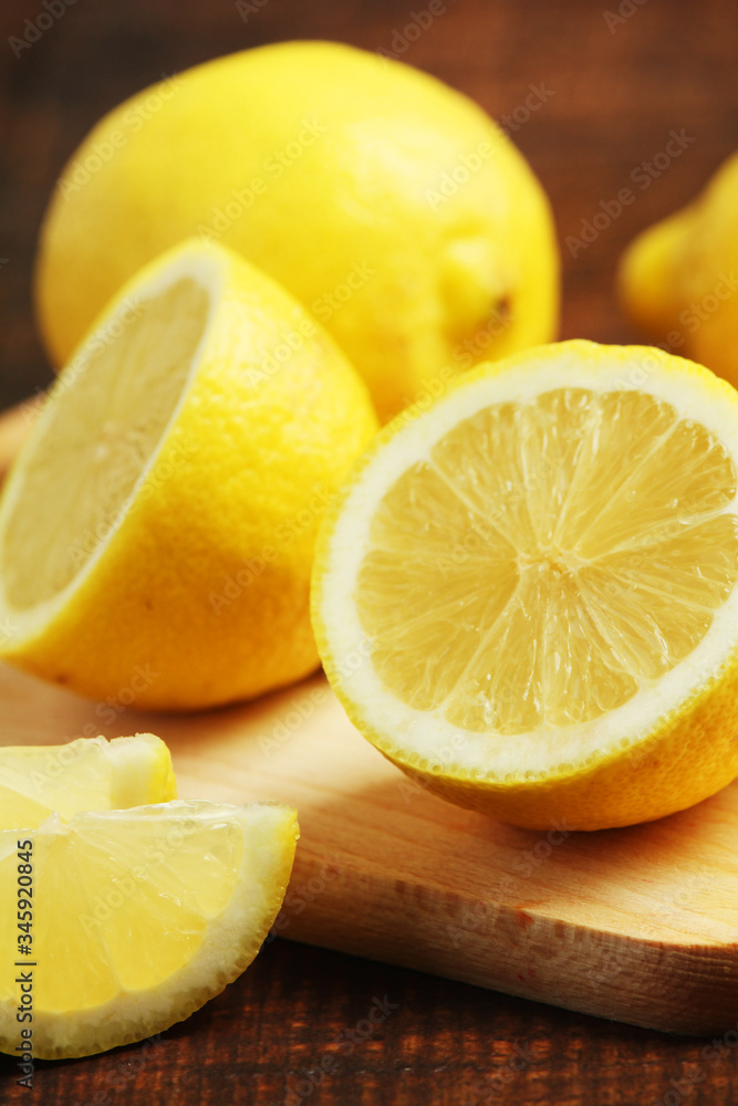 Lemons lying on the wooden rustic table Lemons lying on the wooden rustic table