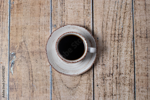 Cup of coffee, espresso on a light wooden background. Cereal natural coffee.