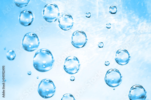 Air bubbles in blue water background, water bubbles texture, sparkling mineral water