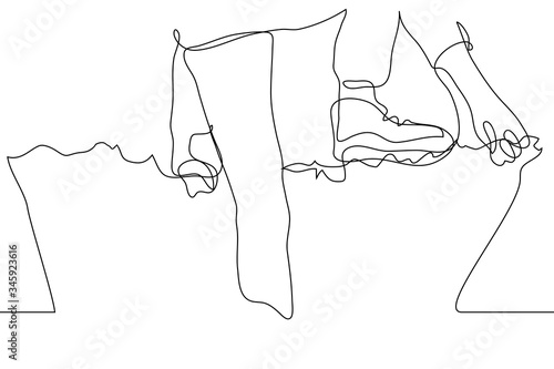 One continuous line drawing of the legs and arms of a person climbing over a barbed net. The concept of overcoming obstacles, the struggle with difficulties, climbing over a wall (grid)