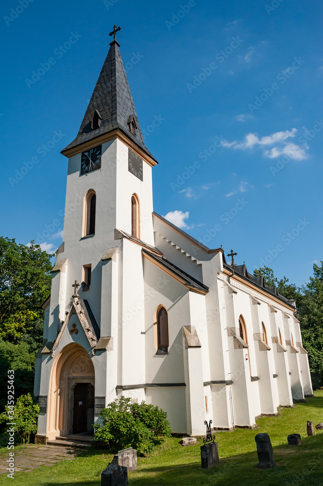 Church of St. John of Nepomuk, Zadni Zvonkova (czech village). Sunny summer day with white chapel cathedral. Sumava, Bohemian Forest, Böhmerwald, Czech Republic.