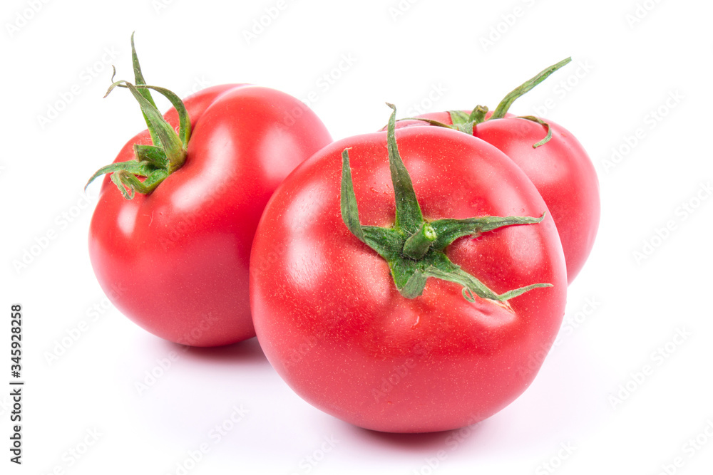 Red fresh tomatoes isolated on white background in close-up Red fresh tomatoes isolated on white background in close-up