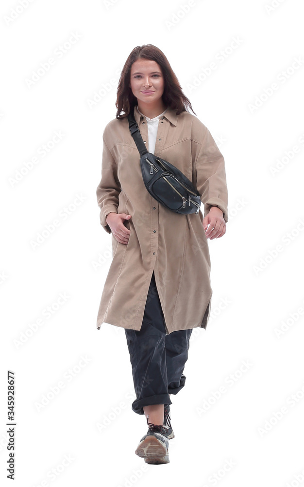 in full growth. pretty young woman walking to a meeting in full growth. pretty young woman walking to a meeting