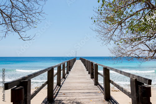 The clear blue sea and the pier