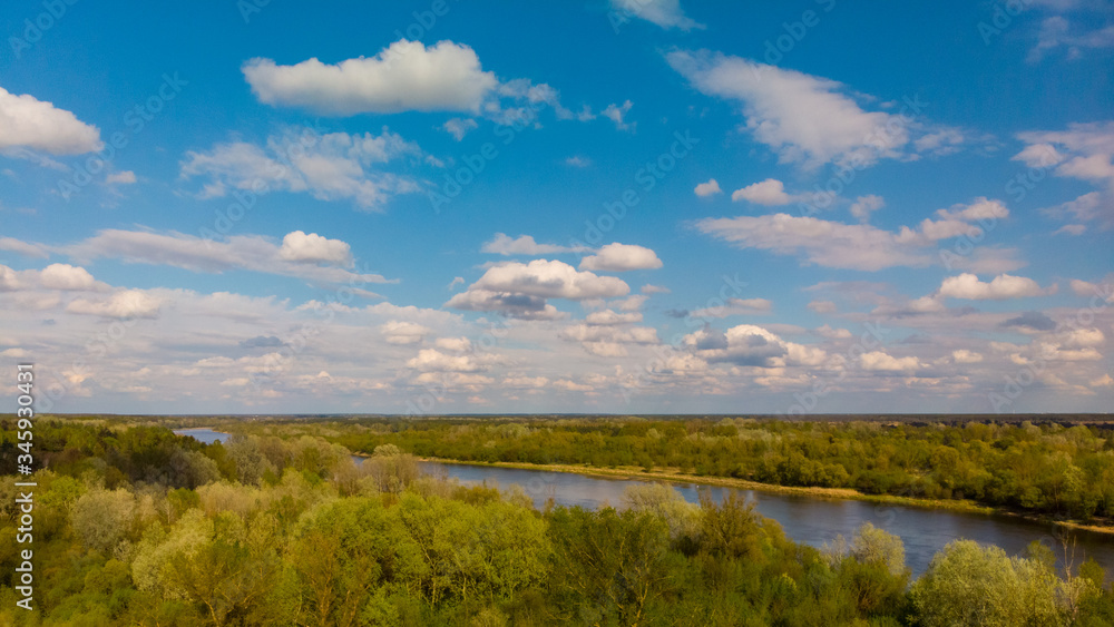 Obraz premium Shot from the drone of the river in which the clouds are reflected