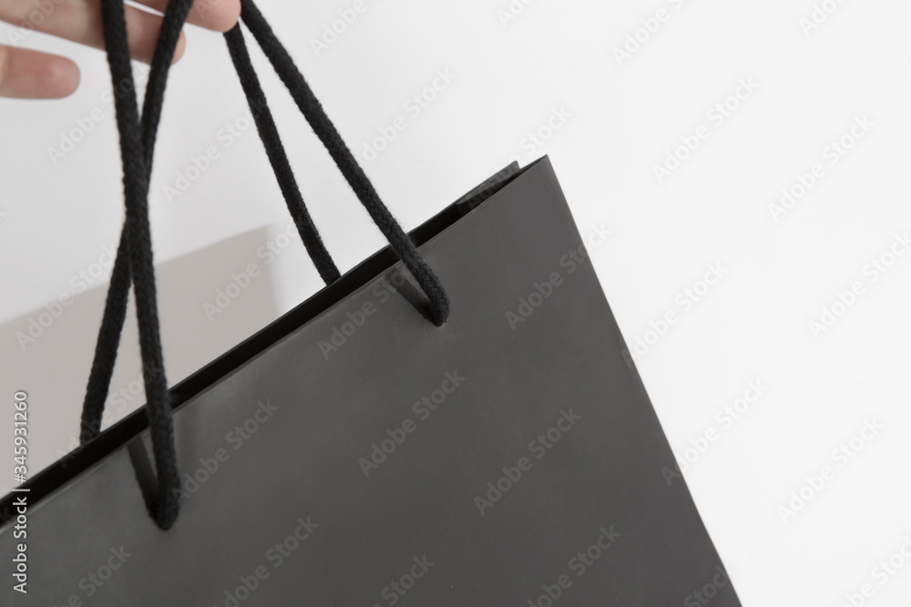black shopping bag hanging