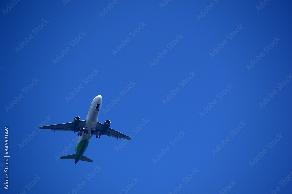 Air Plane is flying in blue sky Air Plane is flying in blue sky