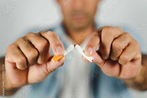 Man hand crushing cigarette, Concept Quitting smoking,World No Tobacco Day.