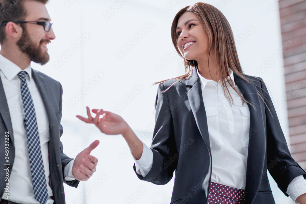 successful business woman talking to a colleague successful business woman talking to a colleague