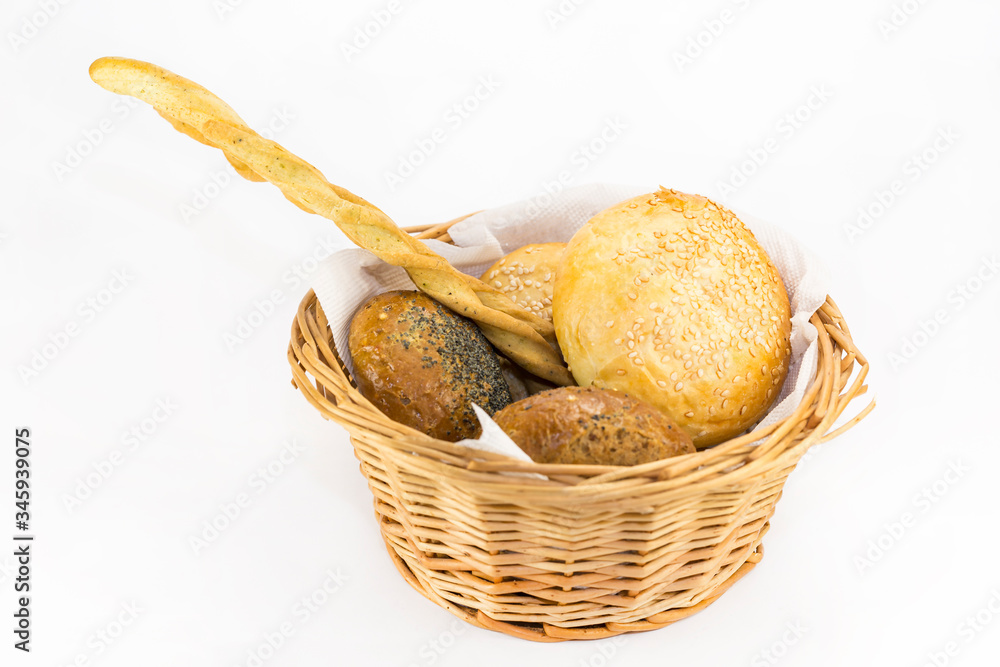 Bread basket with bread rolls and bread sticks.