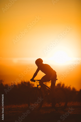 Cyclist man riding mountain bike on a mountain.