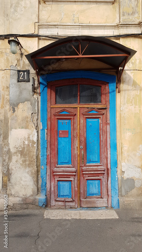 old wooden door. Porch and old door of historic building in European city Odessa of Ukraine © Ninel