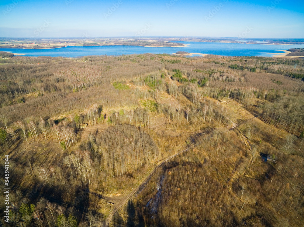 Aerial view of reinforced concrete bunkers belonged to Headquarters of German Land Forces from ww2 hidden in a forest in spring season in Mamerki, Poland (former Mauerwald, East Prussia) Aerial view of reinforced concrete bunkers belonged to Headquarters of German Land Forces from ww2 hidden in a forest in spring season in Mamerki, Poland (former Mauerwald, East Prussia)