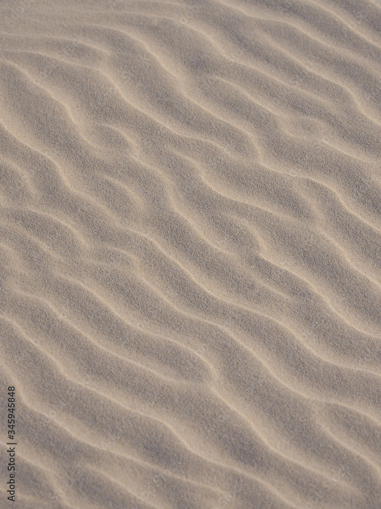 Closeup of yellow sand pattern of a beach in the summer. Closeup of yellow sand pattern of a beach in the summer.