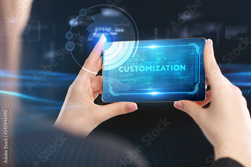 Business, Technology, Internet and network concept. Young businessman working on a virtual screen of the future and sees the inscription: Customization
