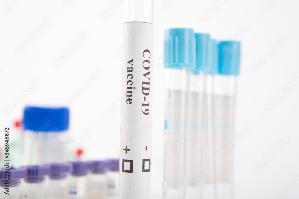 Test tube with a vaccine against coronovirus infection COVID-19 on a white background