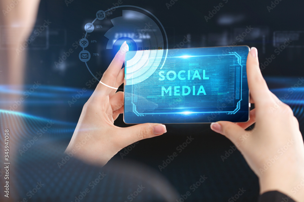 Obraz premium Business, Technology, Internet and network concept. Young businessman working on a virtual screen of the future and sees the inscription: Social media