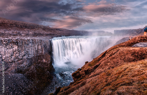 Dettifoss waterfall with dramatic colorful sky during sunset, Icelandic nature scenery Amazing long exposure scenery of famous landmark in Iceland. Creative image best locations for photographers