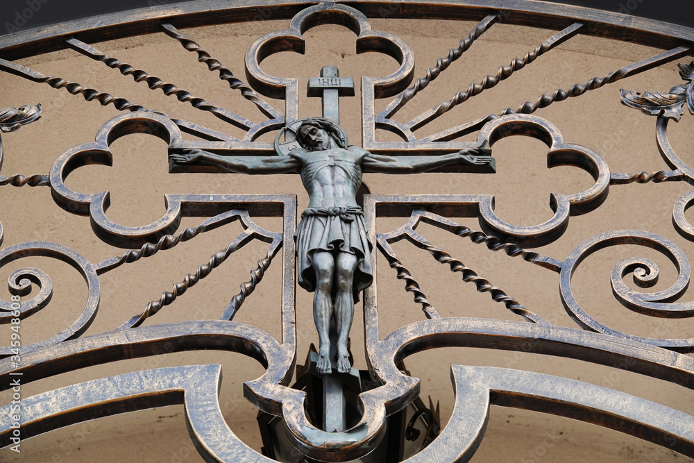Crucifixion of Jesus Christ gate decoration at the entrance to the church