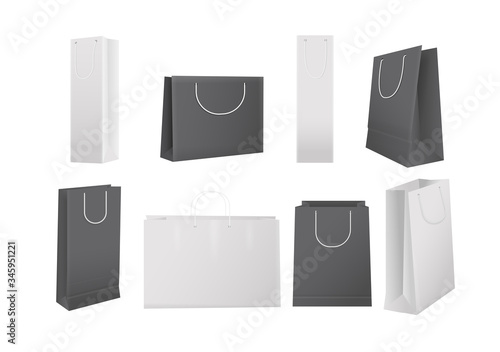 Paper shopping bags. Realistic white and black cardboard shopping bags isolated set of mockup ready for branding and design. Retail consumerism, advertising and promotion vector illustration.