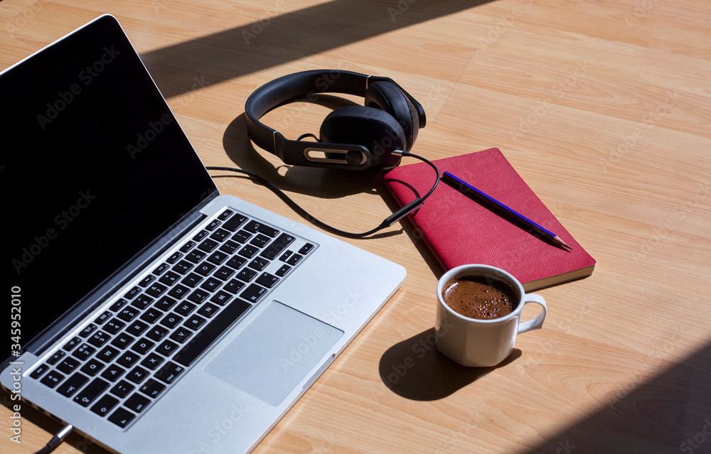 Study, work desk. Online education. Home office.laptop, pen, notebook, coffee and headphones on the table. Study, work desk. Online education. Home office.laptop, pen, notebook, coffee and headphones on the table.