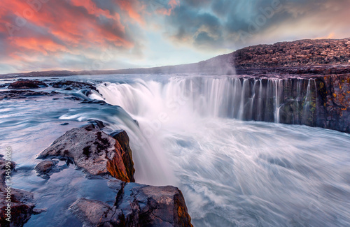 Awesome landscape in Iceland with colorful sky. Selfoss waterfall. Gorgeous summer sunset in Jokulsargljufur National Park, Famous Tourist Attraction. Iconic location for landscape photographers