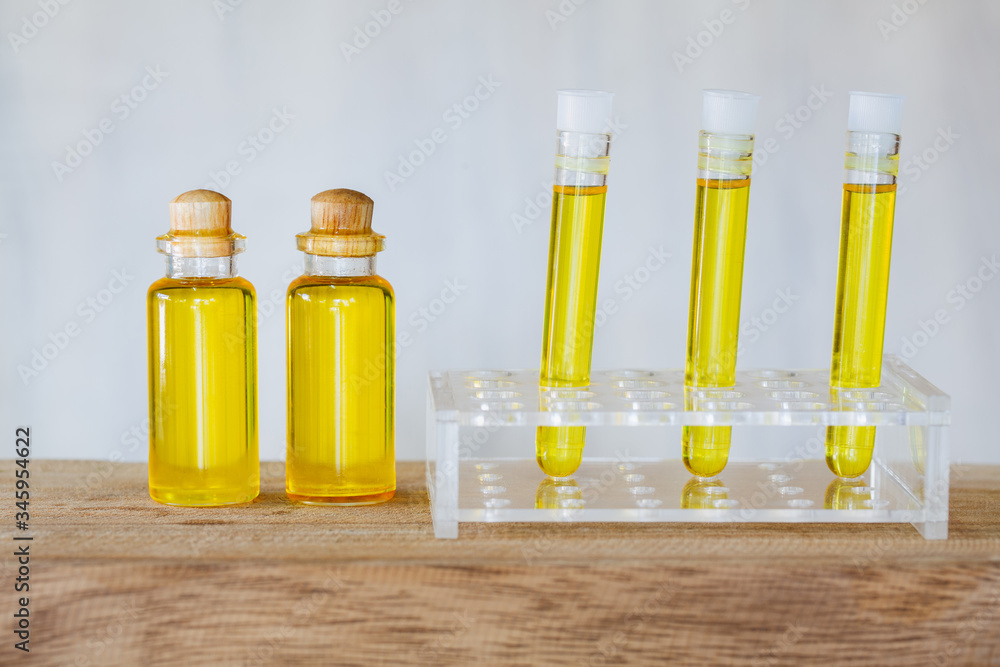 CBD oil hemp products, Medicinal cannabis with extract oil in a bottle on a wooden table. Medical cannabis concept CBD oil hemp products, Medicinal cannabis with extract oil in a bottle on a wooden table. Medical cannabis concept