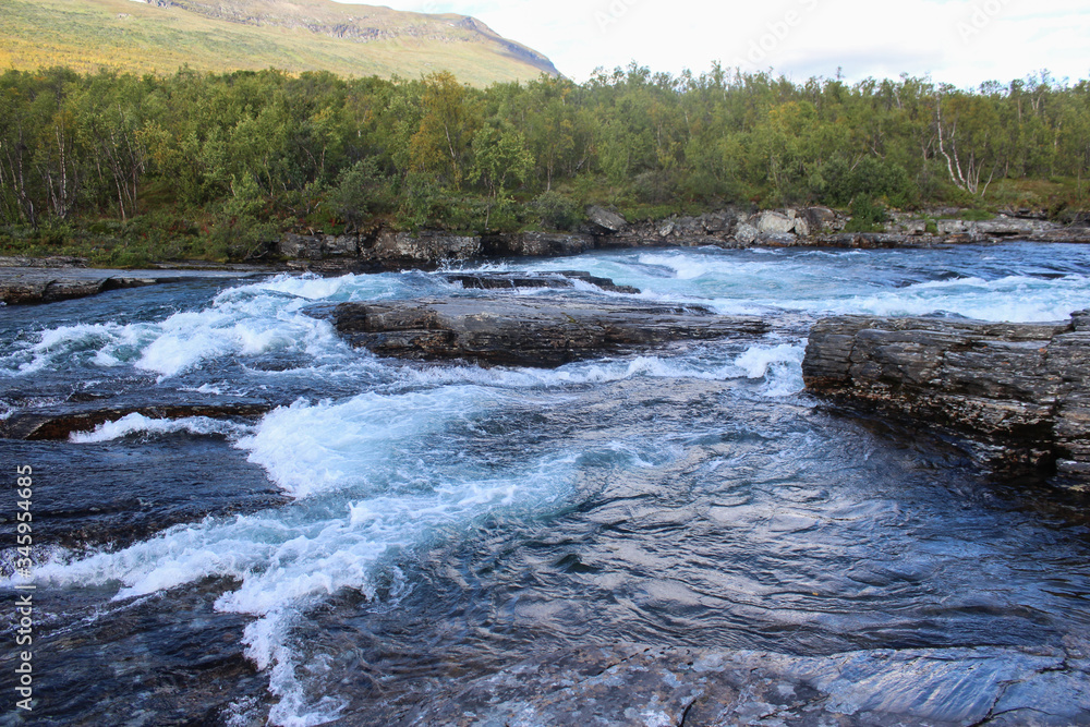 Large river in the arctic tundra. Abisko national park, Nothern Sweden