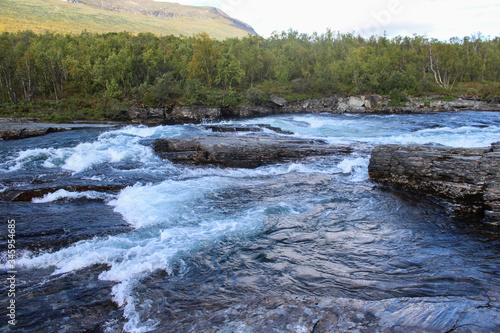 Large river in the arctic tundra. Abisko national park, Nothern Sweden