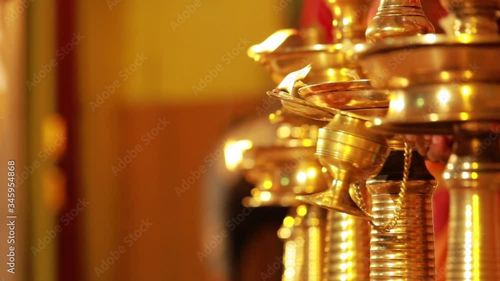Traditional south Indian brass oil lamp 'Nilavilakku '. During events like housewarming, marriage etc., the Nilavilakku is lighted before starting the rituals. This video is taken during a wedding Traditional south Indian brass oil lamp 'Nilavilakku '. During events like housewarming, marriage etc., the Nilavilakku is lighted before starting the rituals. This video is taken during a wedding
