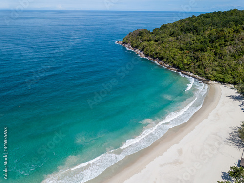 The blue sea and the white sand beach are free from any distractions. Drone photos