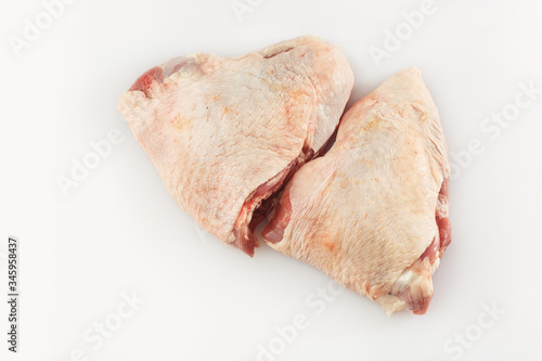 Raw Free range Boneless skinless chicken thighs on stone table. Raw chicken thigh . The view from the top. Food Background. Copy space. Cooking content. Uncooked meat. Meat shop.