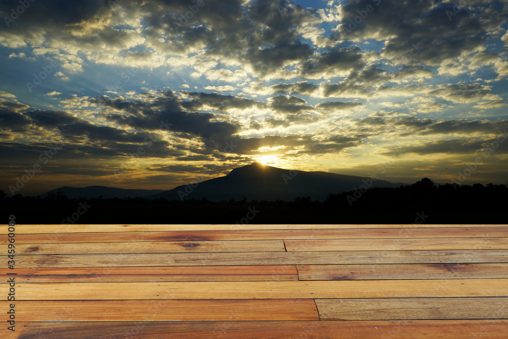 Wooden floor and evening sky background.
