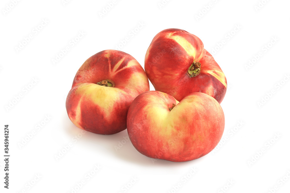 Three flat fig peaches isolated on white Three flat fig peaches isolated on white