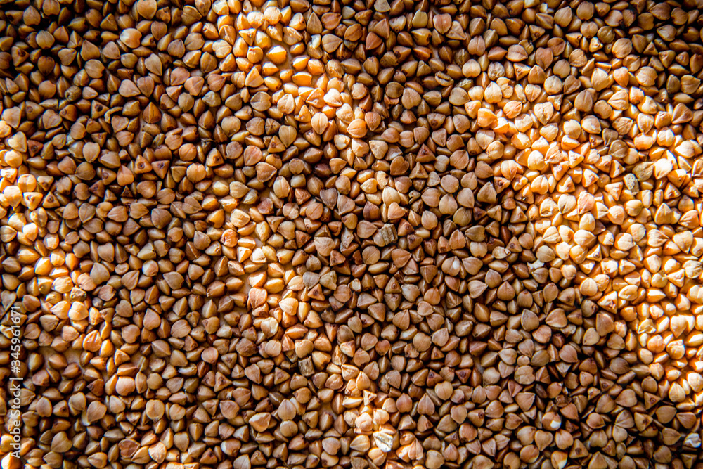 Obraz premium Raw buckwheat background with sunshine