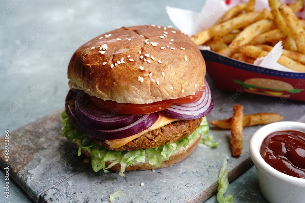 Homemade Veggie Burger with tender Jackfruit with side fries, selective focus Homemade Veggie Burger with tender Jackfruit with side fries, selective focus