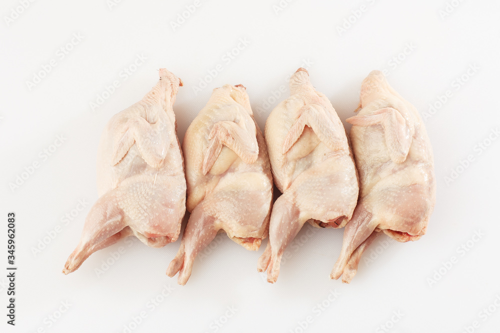 Homemade eco-friendly raw quails ready for cooking. The view from the top. Food Background. Copy space. Cooking content. Uncooked meat. Meat shop. Homemade eco-friendly raw quails ready for cooking. The view from the top. Food Background. Copy space. Cooking content. Uncooked meat. Meat shop.