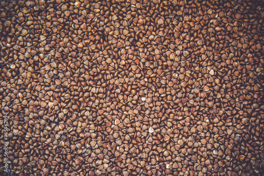 Top view of uncooked buckwheat. Background Top view of uncooked buckwheat. Background