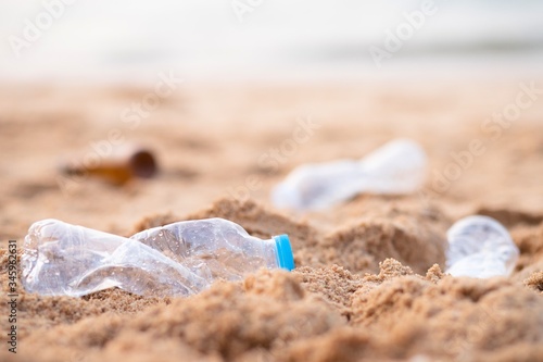 Empty used plastic bottles on the beach.