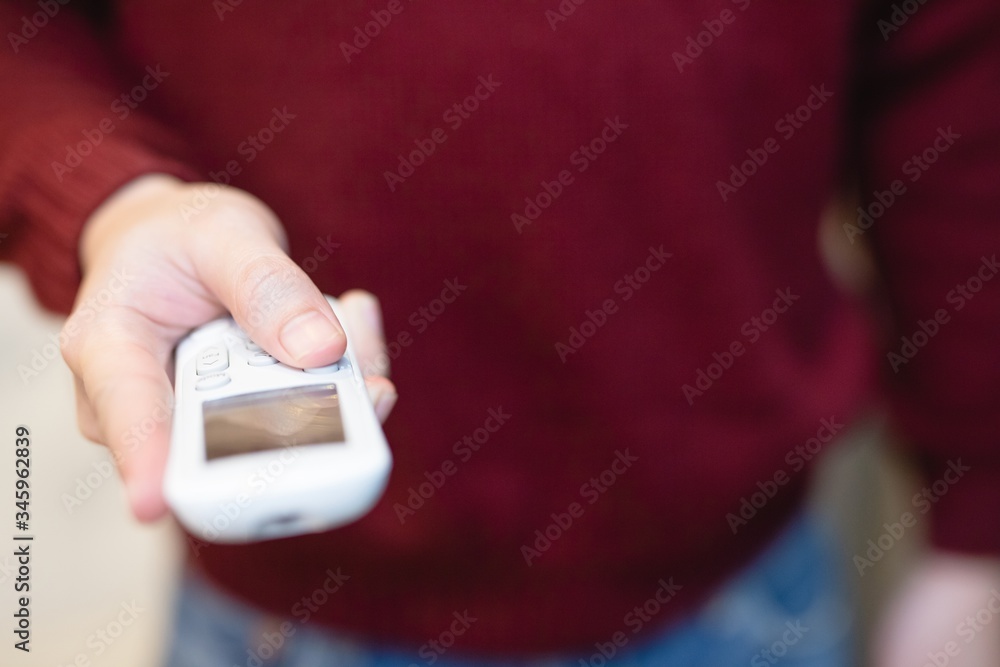 hand holding remote controller air conditioning. hand holding remote controller air conditioning.