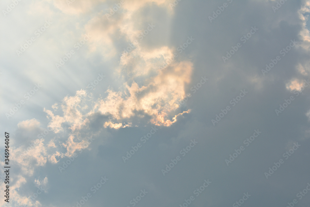 Sun rays coming out from beautiful clouds Sun rays coming out from beautiful clouds