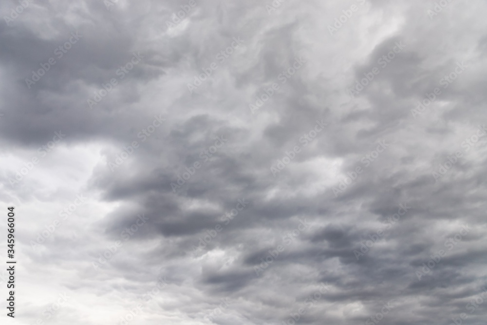 Fototapeta premium Dramatic gray and white clouds in the sky
