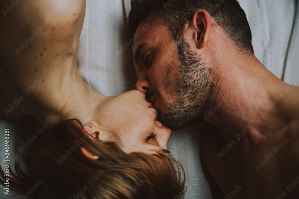 Fototapeta premium young couple relaxing in bed and having fun.