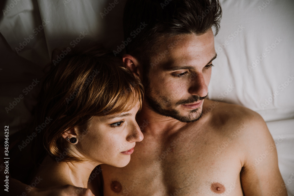 young couple relaxing in bed and having fun. young couple relaxing in bed and having fun.